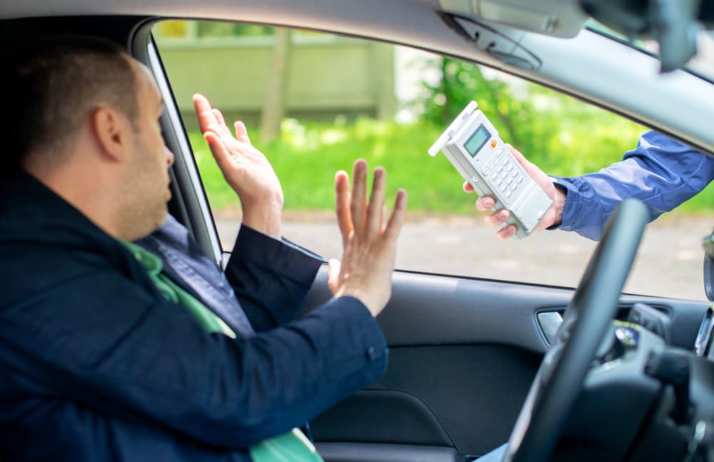 A man sitting in a car and refusing a BAC test in North Carolina