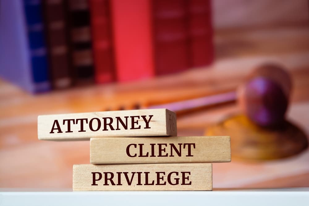 Wooden blocks displaying the words "Attorney-Client Privilege," representing a key legal concept.







