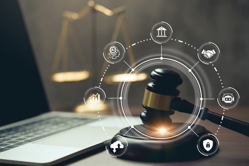 A judicial gavel and laptop with legal icons on the table, representing the concept of AI ethics and AI law, highlighting legal regulations and technology control in artificial intelligence.