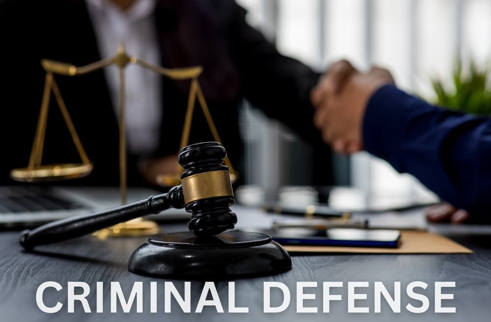 Criminal defense, featuring a gavel, handcuffs, and legal documents on a desk